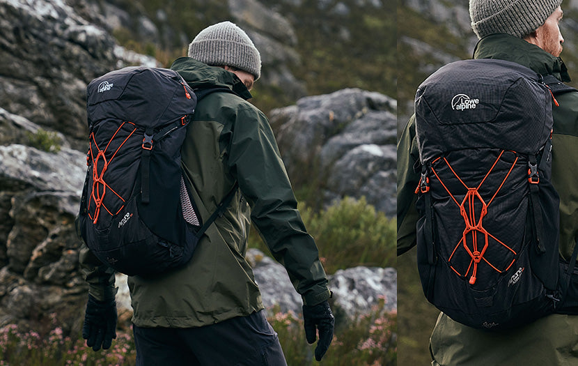 Two outdoor views of a person wearing a large black Hiking Pro backpack with bright orange compression straps, set against a rocky mountain landscape.